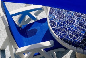 Sea Spray Inn. This is a picture of pool-side blue table and chair