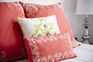Sea Spray Inn. This is a closeup picture of garden-side studio unit colourful pillows
